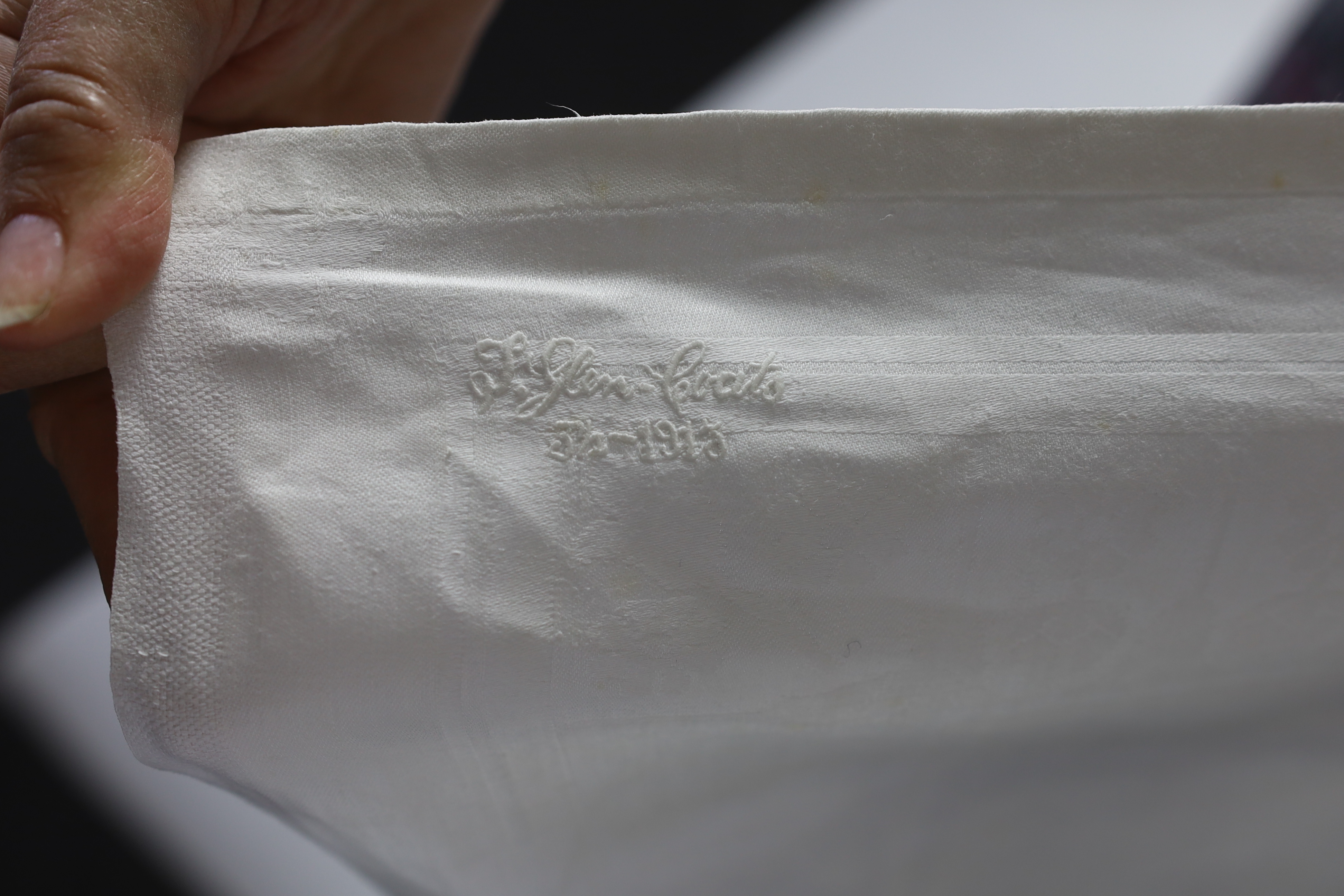 An early 20th century damask table cloth, inspired by Howard Carter’s discovery of Tutankhamun’s tomb in 1922, designed with Egyptian imagery and hieroglyphs, with influences of designers such as Christopher Dresser, emb
